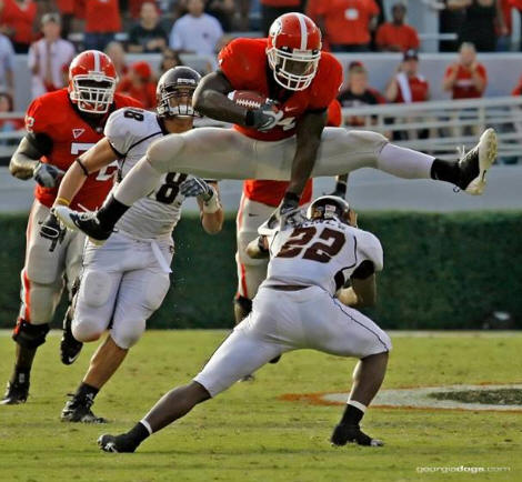 knowshon-moreno-jumps-hurdles-defender.jpg